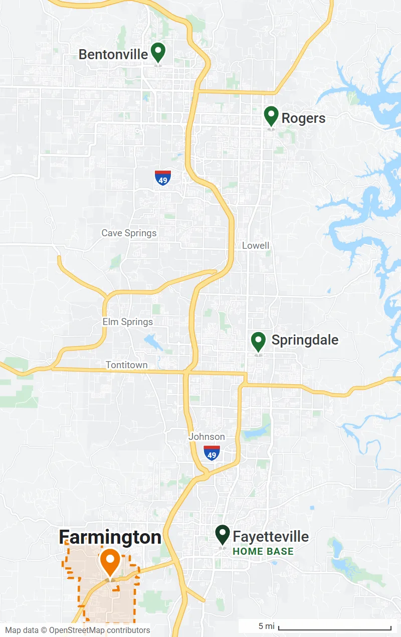 Map of Northwest Arkansas with the Farmington city limits outlined in orange and pins on Bentonville, Rogers, Springdale and Fayetteville (home base)